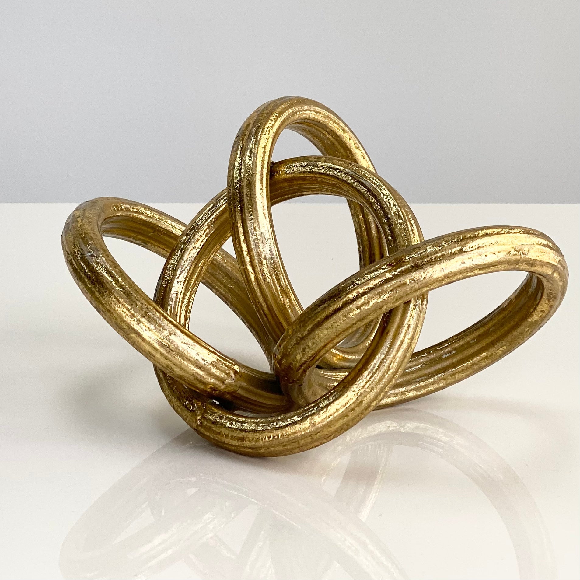 Interlocking Gold Rings Table Top